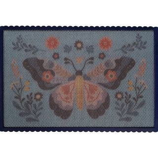 Textile with butterfly pattern on a gray background