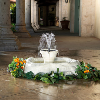 Fountain with flowers in a courtyard setting