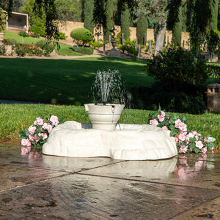 Fountain with flowers in a garden setting